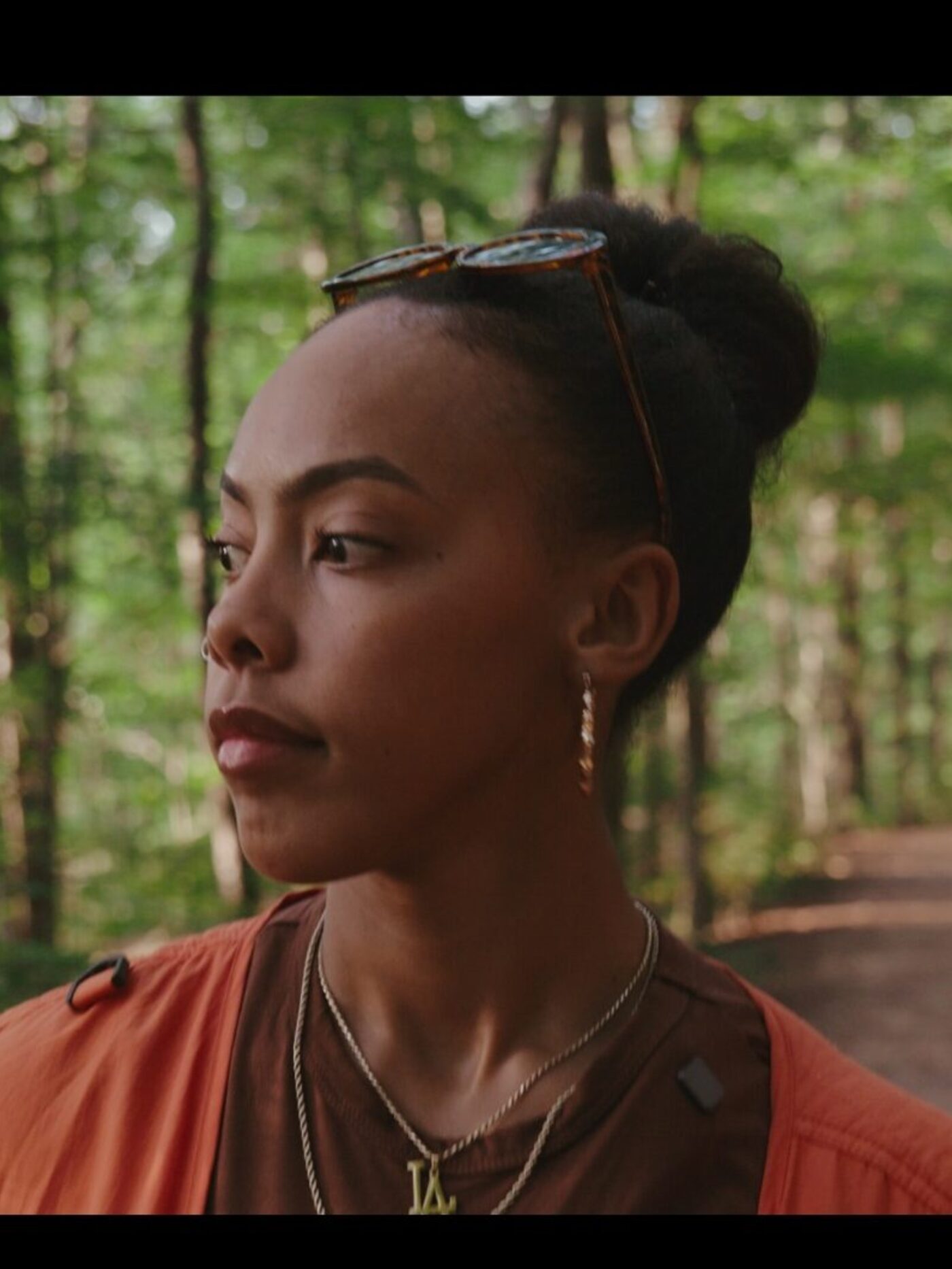 Portrait of the Black N Artsy artist in a wooded, natural-light setting